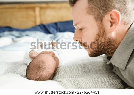 Portrait of a beautiful father, with her nursing baby