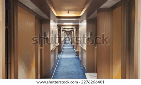 Cruise ship guest hallway with guests cabins on both sides Royalty-Free Stock Photo #2276266401