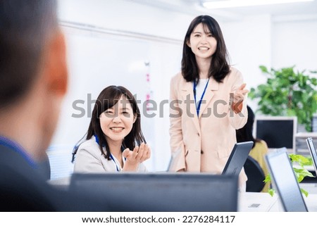 Staff enjoying working in the office Royalty-Free Stock Photo #2276284117