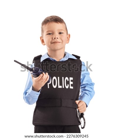 Funny little police officer with radio transmitter and handcuffs on white background