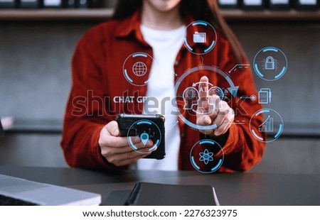 Woman using chatbot in computer and tablet  smart intelligence Ai.Chat GPT Chat with AI Artificial Intelligence, developed by OpenAI generate. Futuristic technology, robot in online system. in office Royalty-Free Stock Photo #2276323975