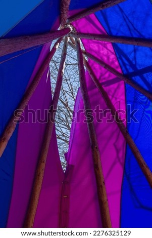 rainbow-colored wigwam from the inside, a traditional dwelling of the Indians

