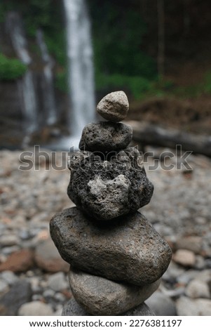 Pile Of Stone at Waterfall Curug Telu Baturraden