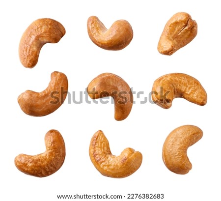 Set of roasted cashew nuts close-up on a white background. Isolated Royalty-Free Stock Photo #2276382683