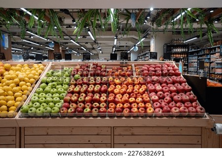 Various type of fresh fruits arrange neatly grocery store. Apple, Orange, Pomegranate, Lemon on rack.  Royalty-Free Stock Photo #2276382691