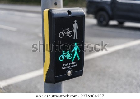 Toucan crossing showcasing green person and bike, safety, transport and travel concept illustration. Royalty-Free Stock Photo #2276384237