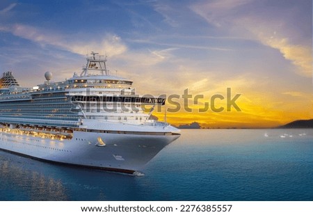 Luxury cruise ship sailing to port on sunrise  Royalty-Free Stock Photo #2276385557