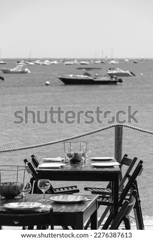 Cap Ferret (Arcachon Bay, France). Tasting terrace at the water's edge Royalty-Free Stock Photo #2276387613