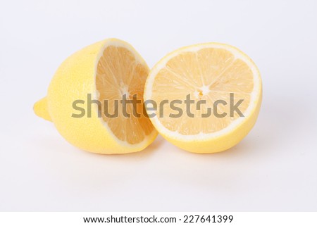 Citrus fresh fruit on white background. Ripe lemons.