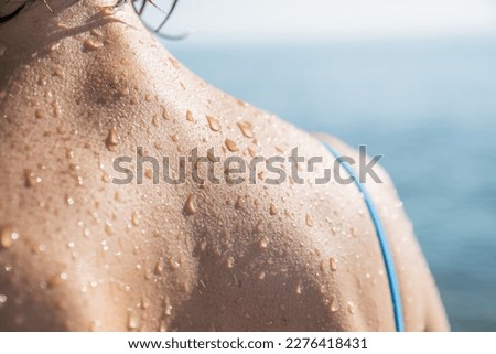 Close-up of water drops on skin Royalty-Free Stock Photo #2276418431