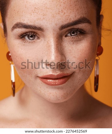 Beauty closeup portrait of charming ginger young woman with natural freckles. Girl looking at camera.  Royalty-Free Stock Photo #2276452569