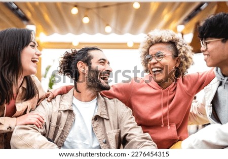 Multi racial friends having fun at fancy venue location - Life style concept with happy men and women sharing time together - College students on cool trendy vacations - Vivid backlight filter  Royalty-Free Stock Photo #2276454315