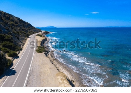 Aerial view of Amiros Beach along the beautiful country road. Located in the northwestern part of the Greek island of Rhodes. Royalty-Free Stock Photo #2276507363