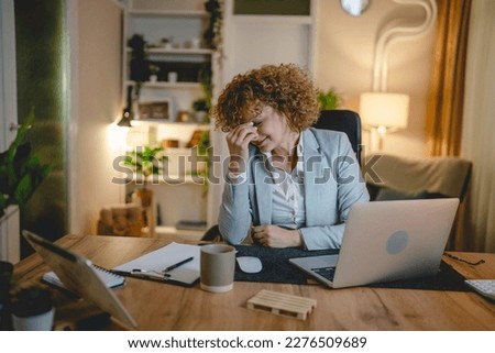 Overworked woman at work place have headache and eye strain pain exhausted female entrepreneur or manager under stress and anxiety having problems at office hold her head real people copy space Royalty-Free Stock Photo #2276509689