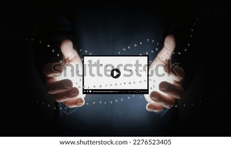 Text to video concept, Hands hold a video generated by a generative AI. An artificial intelligence language model technology.