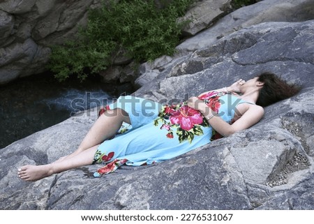 Beautiful girl sleeping on the rocks
, with the ability to edit and the quality of 24 mega pixels