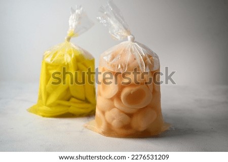 Candied Sweet Snake Fruit and Candied Sweet Ambarella Fruit, Manisan Buah Salak dan Manisan Buah Kedondong, Packed in A Clear Plastic Bag, Indonesian Snack, Selective Focus. Royalty-Free Stock Photo #2276531209