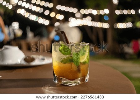 Cocktail glass in the night atmosphere