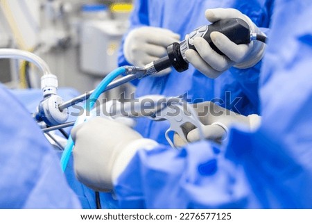 A team of doctor or surgeon did surgery inside operating room in hospital.People holding medical equipment or surgical tool in keyhole endoscopic surgery.Minimal invasive joint arthroscopic procedure. Royalty-Free Stock Photo #2276577125