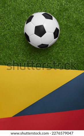 Colombian national soccer team concept background. Colombian flag with soccer ball. Football background. Soccer ball and flag of Colombia.