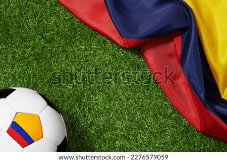 Colombian national soccer team concept background. Colombian flag with soccer ball. Football background. Soccer ball and flag of Colombia.