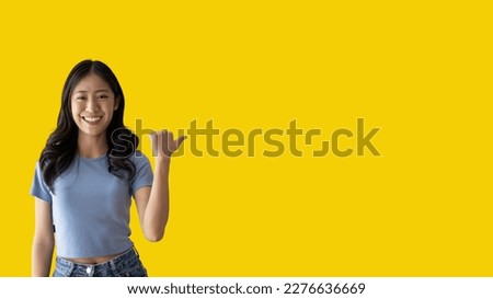 Asian woman pointing finger inviting click here, It is recommended to follow this direction or click on this link, Space for promotion here, Register or apply for membership, Click here.