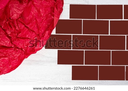 Cards on the table for logo copy paste business card. Brick Wall made of building blocks.