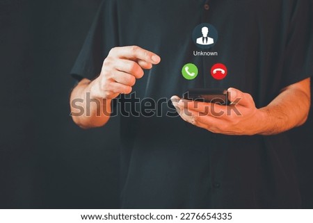 Unknown number calling in the middle of the night. Phone call from stranger. Man answering to incoming call. Phone call from unknown number. Call center gang, scammer or stranger. Royalty-Free Stock Photo #2276654335