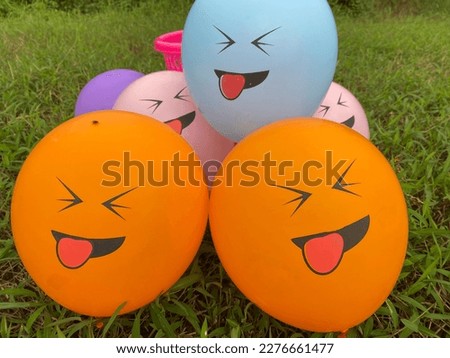 Faced balloons that are in a row