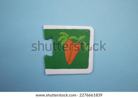 Carrot picture puzzle, Carrot picture puzzle placed over blue background.