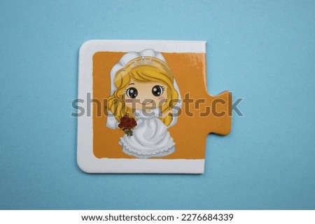 Bride picture jigsaw, bridal picture jigsaw taken from above, placed on a blue background.