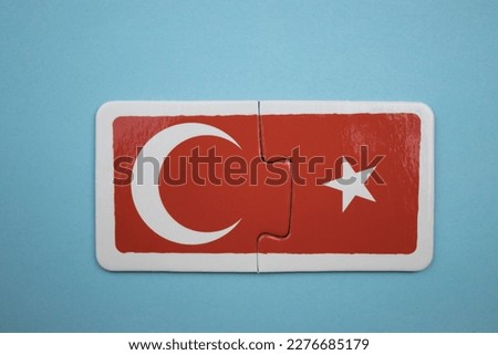 Turkish flag picture puzzle, Turkish flag picture puzzle taken from above, placed on blue background.