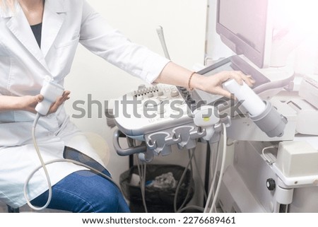 Smiling doctor, ultrasound. The doctor performed an ultrasound