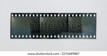 blank filmstrip with three empty cells isolated on white paper background, vintage retro photo placeholder mock up.