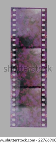 single 35mm filmstrip with strange developing chemical smear marks, film texture.