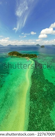 aerial vertical panoramic photography of snake island in the archipelago el Nido, Philippines with cloudy sky and some tourist's boats
