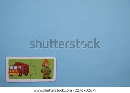 fire engine and fire truck picture puzzles, fire and fire truck picture puzzles taken from above, placed on the left of a blue background
