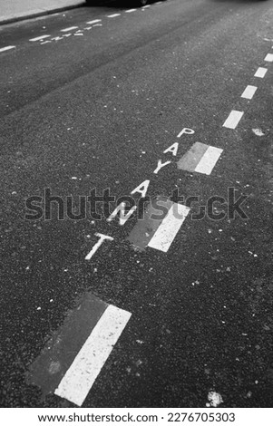 Road markings with white paint on asphalt - parking restriction on the roadway