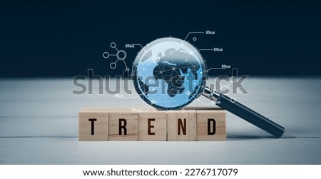 World business trend online technology, opportunity, seo, information network marketing concept. Word trend on wood block with magnifying glass. Creative vision target, searching website, social media Royalty-Free Stock Photo #2276717079