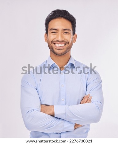 Portrait, smile and business man with arms crossed in studio isolated on a white background. Ceo, professional boss and happy, confident or proud Asian male entrepreneur from Singapore with job pride
