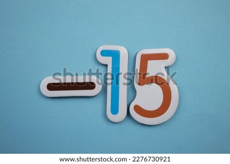 minus 15 is the colorful inscription minus 15 overlaid on a blue background.