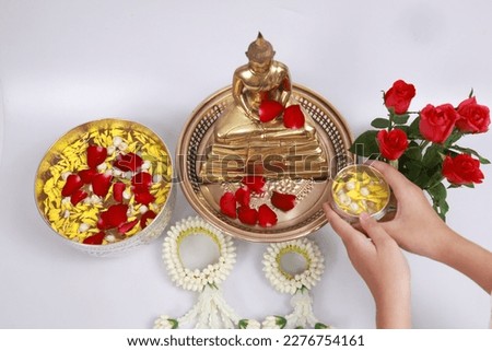 religion, buddha, buddhism, culture, songkran, festival, pour, tradition, blessing, people, happy, statue, buddhist, celebration, flower, hand, holiday, sprinkle, water, asia, day, season, summer, tha Royalty-Free Stock Photo #2276754161