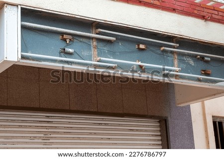 Defective Overhead Neon Store Sign
