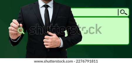 Gentleman in black office suit standing with pen in his hand and pressing virtual button. Man presenting new technologies for future. Futuristic digital design with glow.