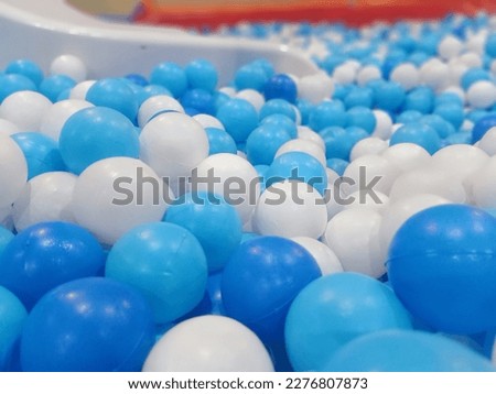 Indoor modern children's play. Inside a beautiful children's playground with slides. Panoramic view of plastic dry pool with colorful balls for playing