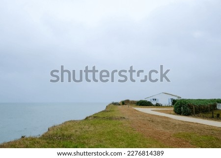 View of Atlantic coast French village, Cloudy day