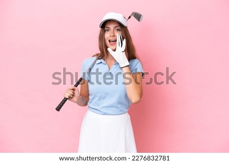 Young golfer player man isolated on pink background shouting with mouth wide open