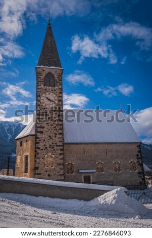 Small church in St. Magdalena or Santa Maddalena in Geislergruppe or Gruppo dele Odle Italian Dolomites Alps mountains. January 2023 Royalty-Free Stock Photo #2276846093
