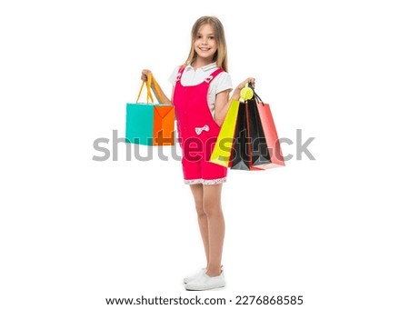 full length of teen girl with shopping bag on background. photo of teen girl with shopping bag.