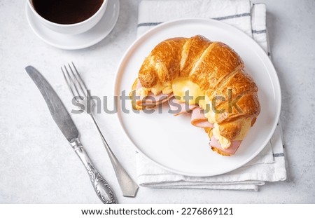 Ham cheese scrambled eggs croissant for breakfast. toning Royalty-Free Stock Photo #2276869121